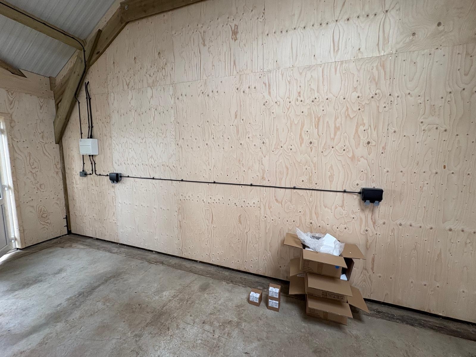 Barn conversion interior with pendant lighting installed