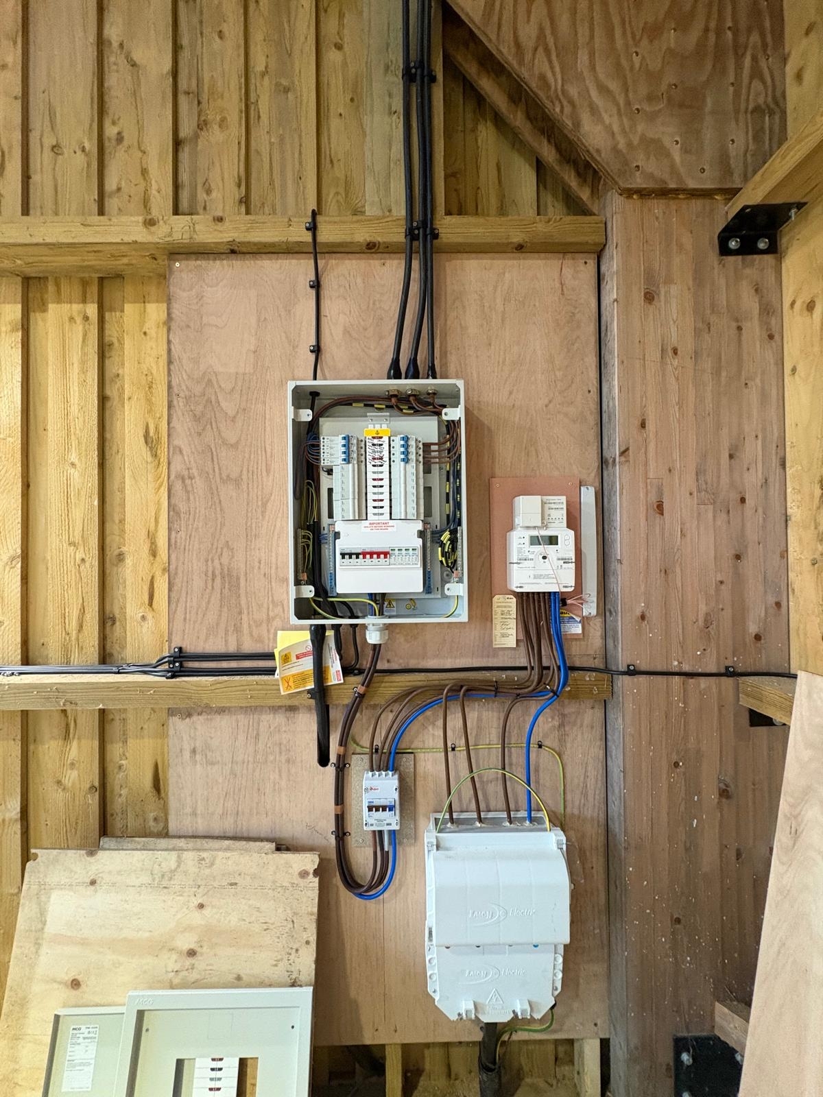 Distribution board and meter installation in a timber-framed building